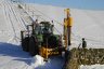 Profi Magnum - A general view of Allison Fencing's outfit. Another deer strainer being driven prior to the line wire being tensioned up.