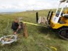  - A railway sleeper strainer of an existing traditional fence being pulled back vertical after years of pressure from heavy snow loadings.