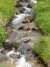  - Mountain streams (burns in Scotland) at this altitude are very shallow in depth as there is negligible vegetation, topsoil and subsoil to erode. If you peel away the skin of vegetation that is there, what is revealed is ground conditions that are the most extreme. The Bryce Suma with rockspike is designed and built to cope with these conditions.

