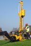Powershift HD1 - HD1 Super in action. If the post goes out of line with the mast whilst driving the post, a certain amount of realignment between the post and mast can be obtained by turning the steering on the telehandler to move the post driver left or right.